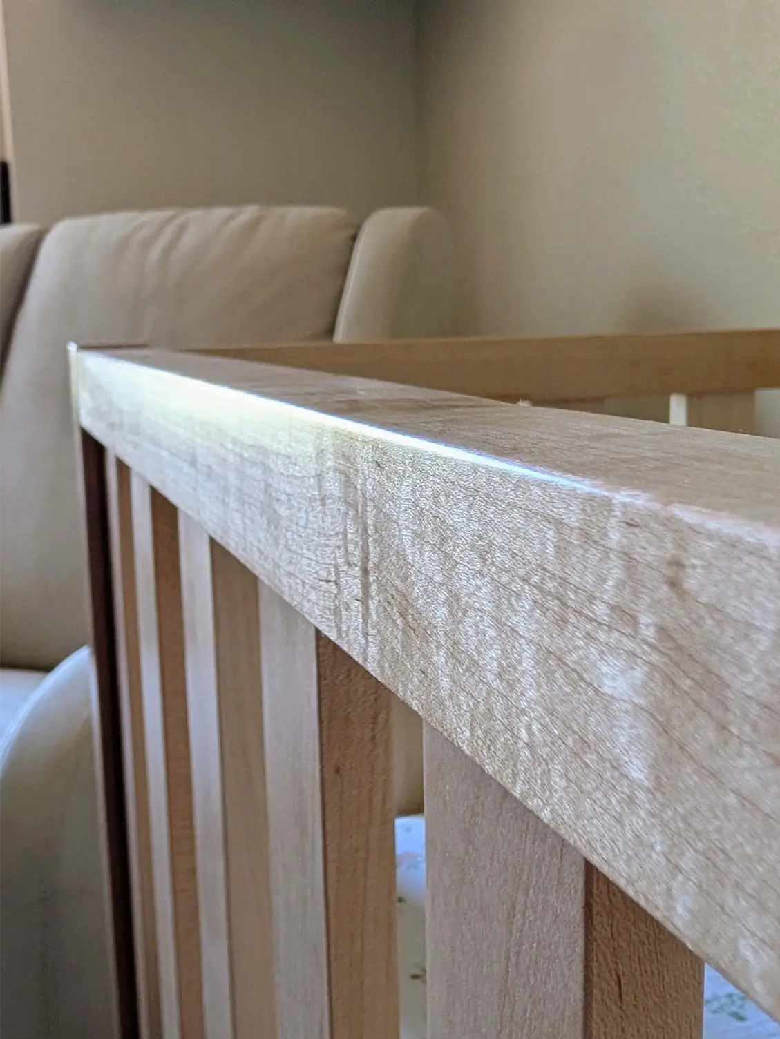 Handcrafted wood crib safety rail assembly