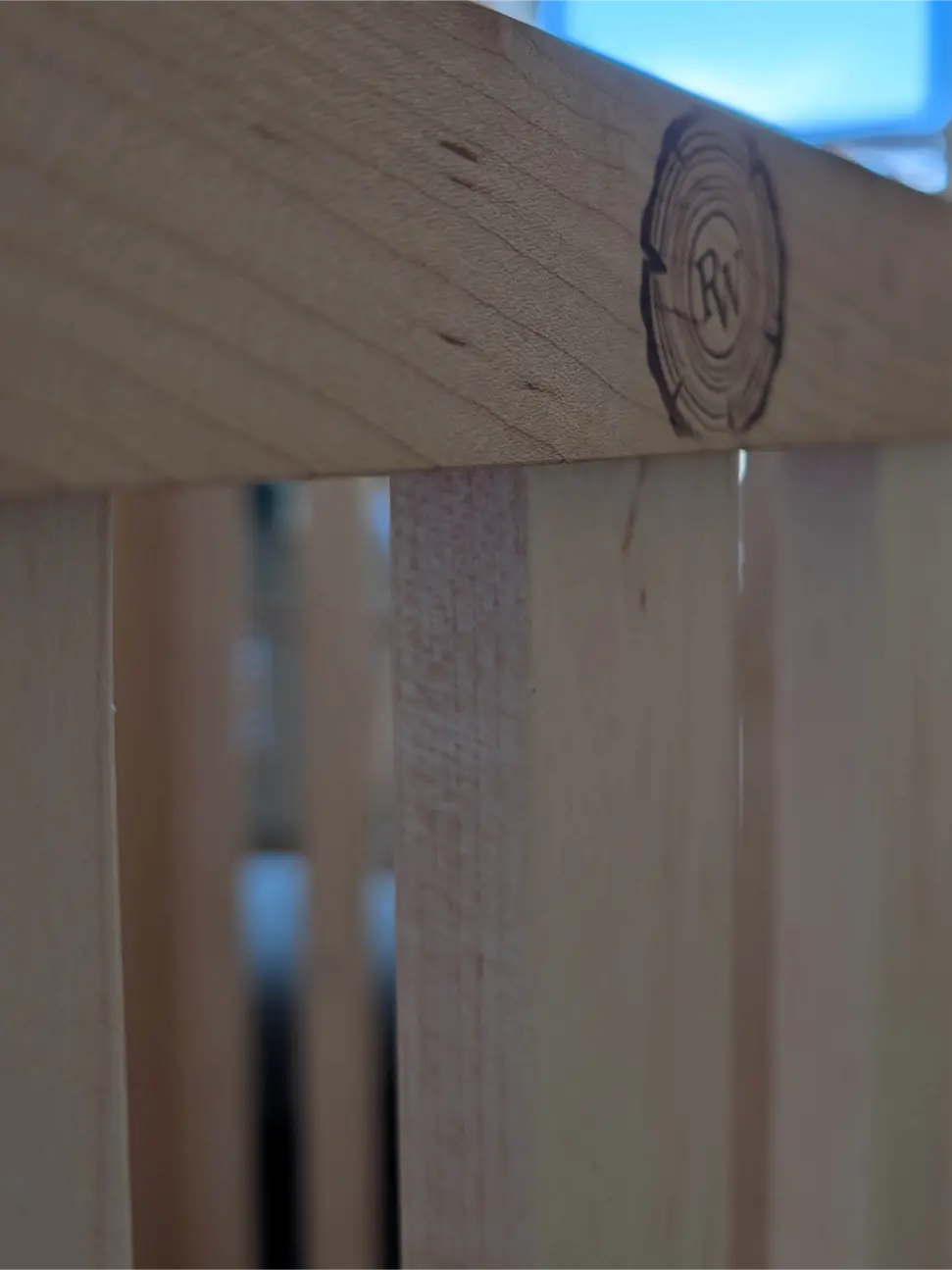 Woodworking detail of a custom crib rail
